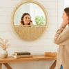 A stylish 20-inch circular wall mirror featuring woven paper rope details.