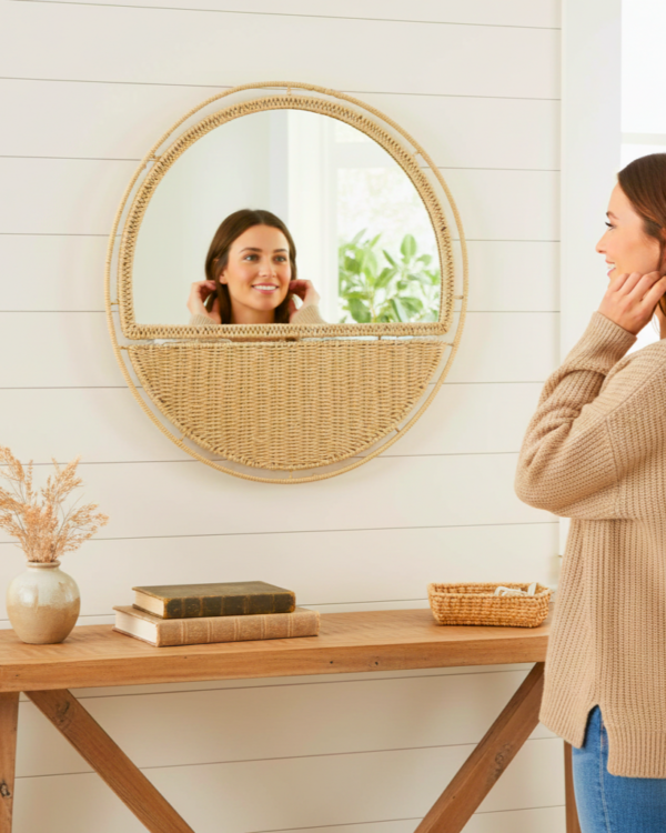A stylish 20-inch circular wall mirror featuring woven paper rope details.