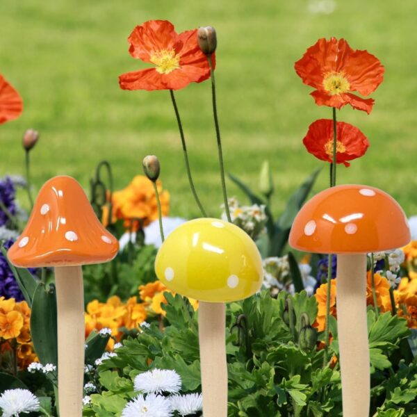 Six colorful porcelain mushroom stakes for fairy gardens and potted plants.