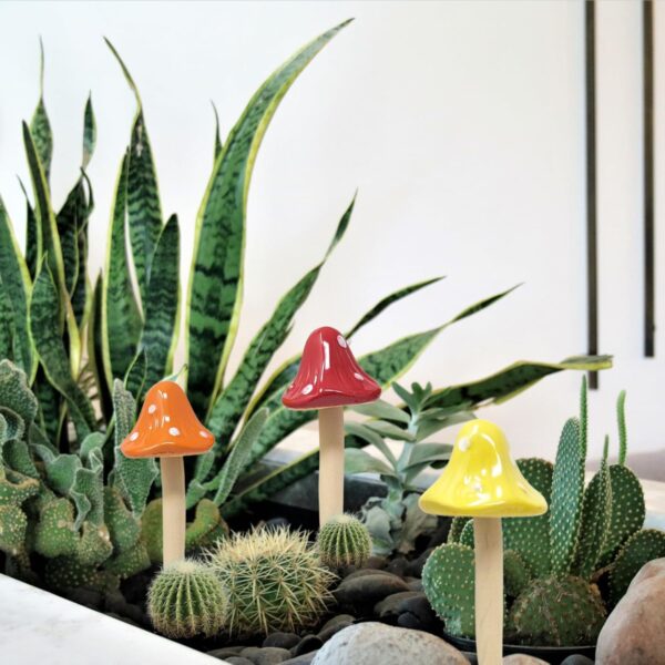 Six colorful porcelain mushroom stakes for fairy gardens and potted plants.