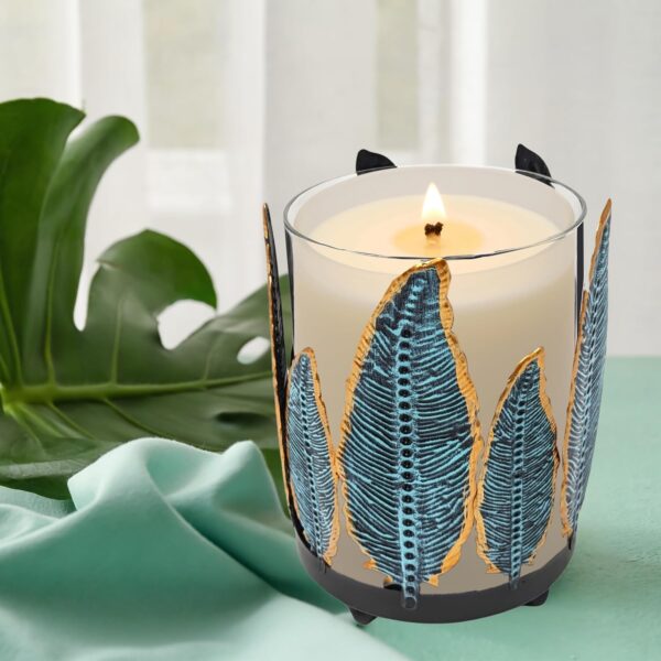 Southwest-style metal feather candle holder with removable glass hurricane chimney.