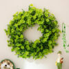 Festive St. Patrick's Day artificial shamrock garlands and wreaths for lucky door decor.
