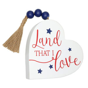 SAT2007c__23861 Decorative white heart plaque with a tassel and patriotic message.