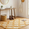 Handcrafted 24x36 inch natural jute rug featuring a classic braided diamond pattern.